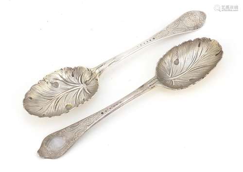 Near pair of Georgian silver tablespoons, the bowls embossed with berries, indistinct hallmarks, the