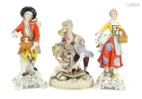 Three continental hand painted porcelain figures including a Meissen style group of two lovers and