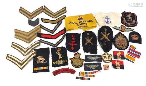 British military and naval cloth patches together with a Civil Defence Corps arm band, including The