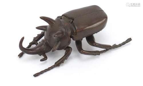 Japanese patinated bronze rhinoceros beetle, impressed character marks to the underside, 10cm in