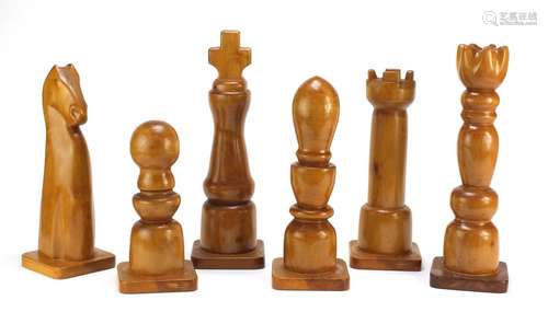 Six oversized carved wood chess pieces, the largest 38cm high : For Further Condition Reports Please