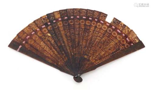 Chinese Canton tortoiseshell brisé fan, finely carved with panels of pagodas amongst flowers and