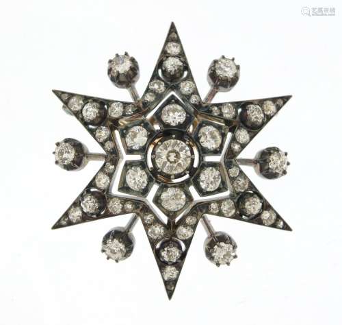 Good Victorian unmarked diamond starburst brooch pendant, set with fifty solitaire diamonds, 4.5cm