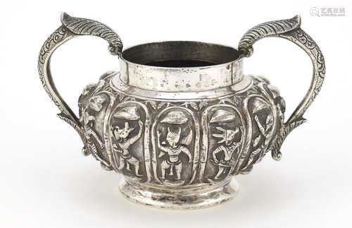 Indian unmarked silver twin handled sugar bowl, embossed with mythical figures, 14cm wide, 245.