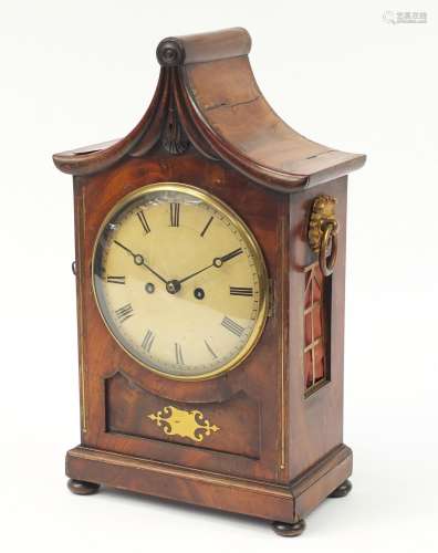 Regency mahogany pagoda topped bracket clock with inset brass panel to the front, flower head design