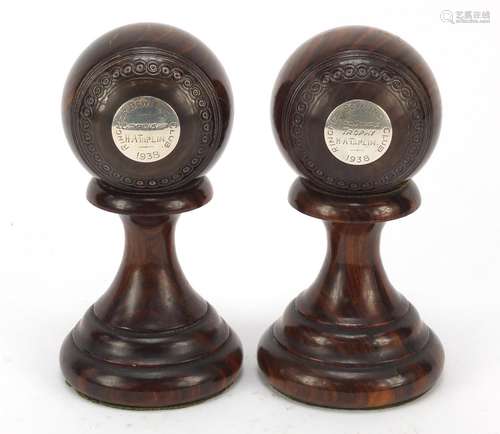 Two lignum vitae presentation bowls on stands by Taylor-Rolph of London, each with inset silver