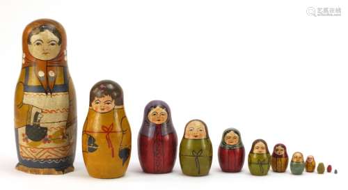 Early Russian Matryoshka hand painted stacking doll comprising twelve inter-fitting dolls, the