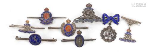 Eight silver and enamel British military brooches including Royal Engineers, the largest 5cm wide,