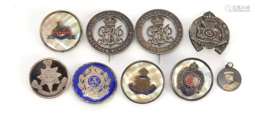 Seven British Military silver brooches and a pendant including two Services Rendered, three with