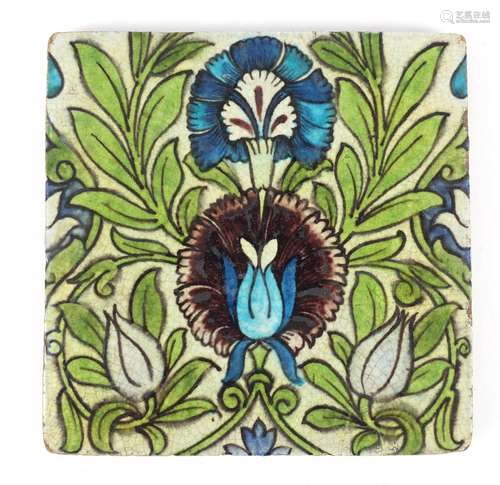 Arts & Crafts pottery tile hand painted in the Iznik manner with flowers, by William de Morgan,