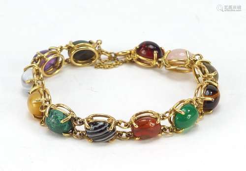 Good 18ct gold bracelet set with symmetrical cabochon semi precious stones including quartz,