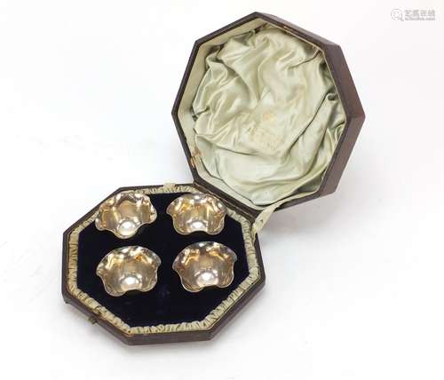 Set of four Victorian silver salts by Fenton Brothers, housed in a George Edward & Sons velvet and