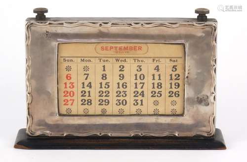 George V rectangular silver mounted and ebonised perpetual desk calendar by WJ Myatt & Co,