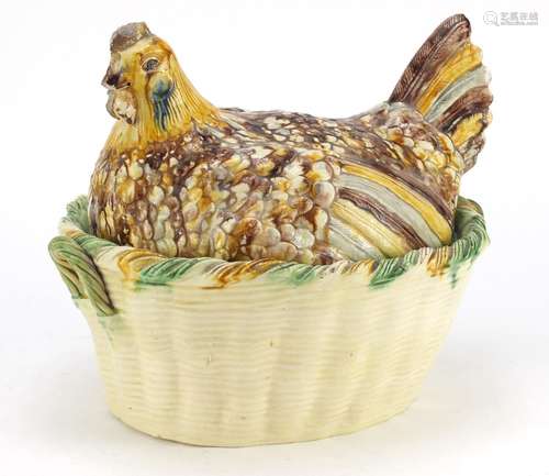 Antique hand painted pottery tureen cover in the form of a chicken on a basket, 25cm high x 30cm