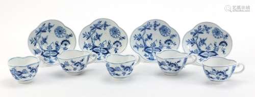 Five Meissen demitasse cups and four saucers, each hand painted in the Blue Onion pattern, crossed
