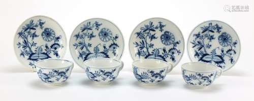 Four Meissen cups and saucers hand painted in the blue onion pattern, crossed sword marks to the