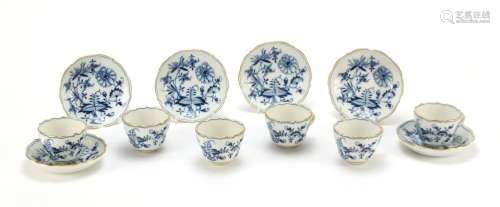 Set of six Meissen fluted cups and saucers, each hand painted in the Blue Onion pattern, crossed