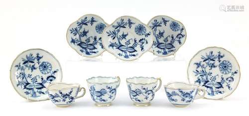 Meissen porcelain hand painted in the blue onion pattern comprising two fluted cups with saucers,