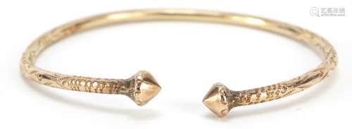 Unmarked gold bangle, (tests as 9ct gold) engraved with flowers, 7cm wide, 23.2g : For Further