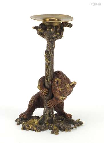 Cold painted bronze candlestick in the form of a bear hugging a trunk in the style of Franz Xaver