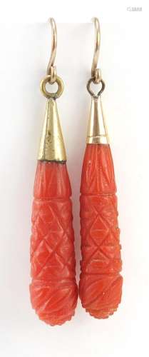 Pair of Victorian carved coral drop earrings with gold coloured metal mounts, 4.2cm in length, 3.
