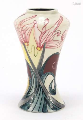 Black Ryden vase hand painted with stylised flowers, impressed marks and painted initials to the