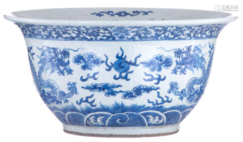 A Chinese blue and white jardinière, decorated with a pair of ******s chasing a flaming pearl amidst