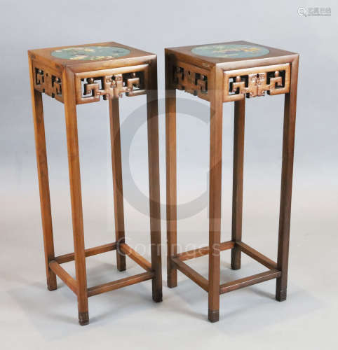 A pair of Chinese hardwood vase stands, each inset with cloisonne panels depicting birds on a branch