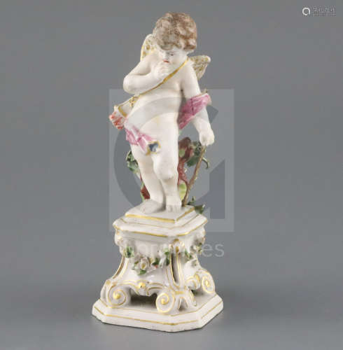 A Bow porcelain figure of Cupid, c. 1765-70, holding his bow and standing on a square pedestal