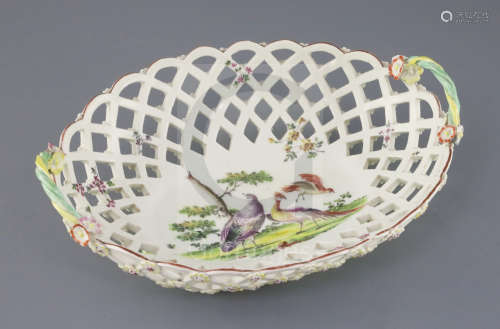 A large Derby oval basket, c.1760, the centre painted with exotic birds in a landscape, the exterior