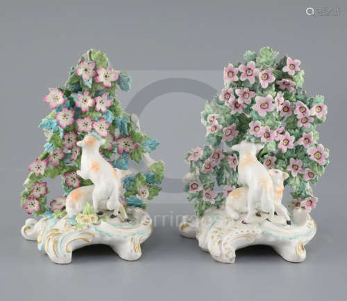 Two similar Derby groups of sheep in a flower arbor, c.1765, scrollwork bases, one with patch marks,