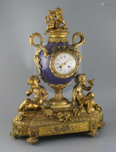 Vernet, Rue du Bac 42. A 19th century French ormolu and bleu d***oi porcelain mantel clock, of urn