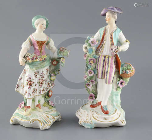 A pair of large Derby figures of flower sellers, c.1760, with flower painting to her skirt and his