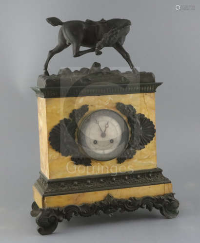 A Charles X French bronze and Sienna marble mantel clock, surmounted with the figure of a