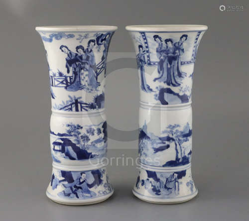 A pair of Chinese blue and white beaker vases, Gu, Kangxi period, each painted to the upper register