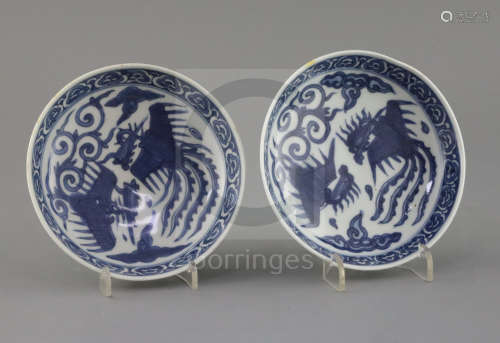 A pair of Chinese Ming blue and white 'phoenix' saucer dishes, pseudo Wanli mark, 17th century,