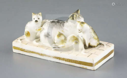 A rare Rockingham group of a cat and three kittens, c.1830, on a 'tiled' floor base, unmarked, L.