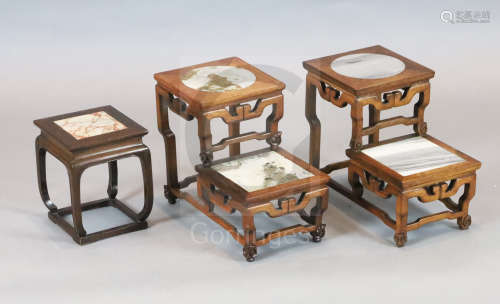 A pair of Chinese hardwood two tier vase stands, inset with marble panels, width 32.5cm, depth 19cm,