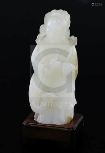 A fine Chinese white and russet jade group of Xi Wangmu and a phoenix, 19th/20th century, the