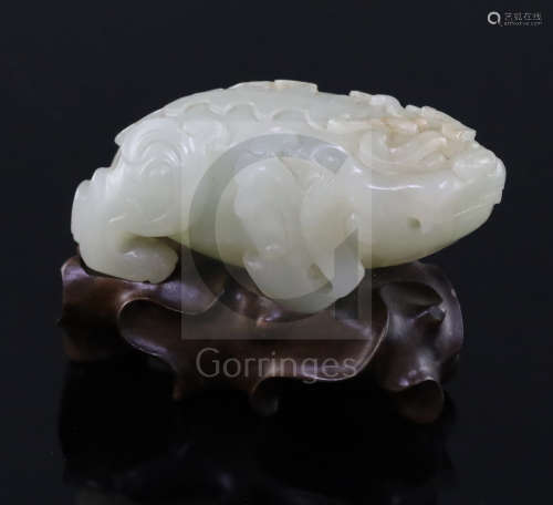 A Chinese pale celadon jade figure of lion-dog, bixi, 17th century, the stone of ***n tone with