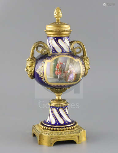 A late 19th century French ormolu mounted Sevres style porcelain cassolette, painted with panels