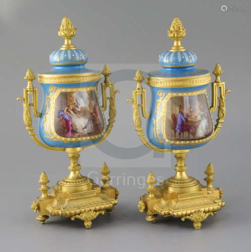A pair of 19th century French ormolu mounted Sevres style porcelain urns, with jewelled