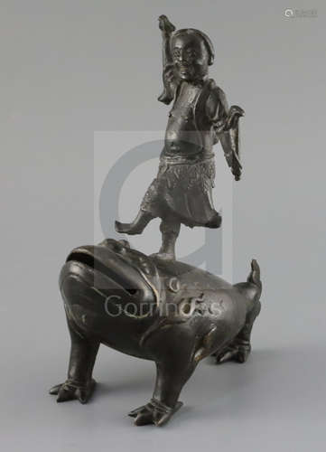 A late Ming bronze joss stick holder of Lui Hai standing on the back of a three legged toad, width