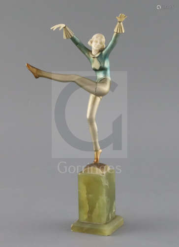 An Art Deco cold painted bronze and ivory figure, by Dakon, signed to the base, on a green onyx