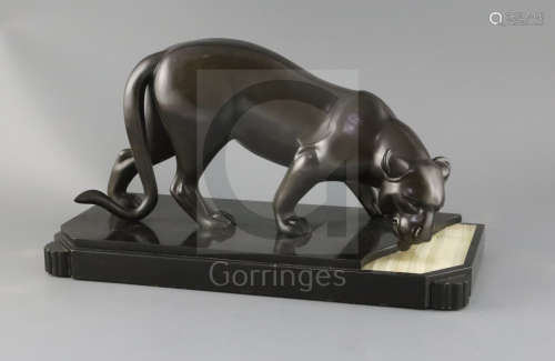 Attributed to Irene Rochard. A French Art Deco bronze model of a panther drinking from a stream,