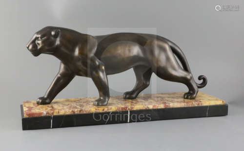 A French Art Deco bronze model of a prowling panther, on two colour marble plinth, width 21.75in.