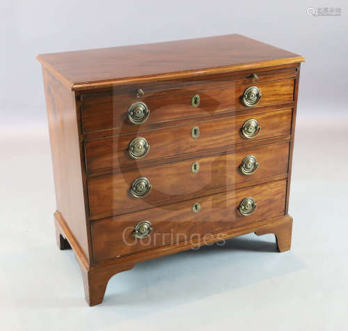 A George III maho***y chest with brushing slide and four graduated long drawers. on bracket feet W.