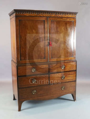 A George III Hepplewhite period maho***y dwarf linen press with moulded cornice and two panelled