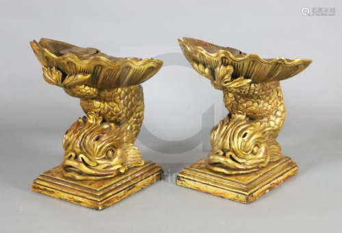 A pair of Venetian and painted giltwood grotto stools, with scallop and acanthus seats on dolphin
