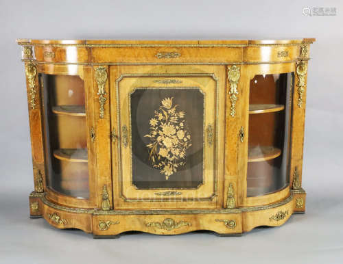A Victorian marquetry inlaid ormolu mounted figured walnut credenza, of D shaped form with central